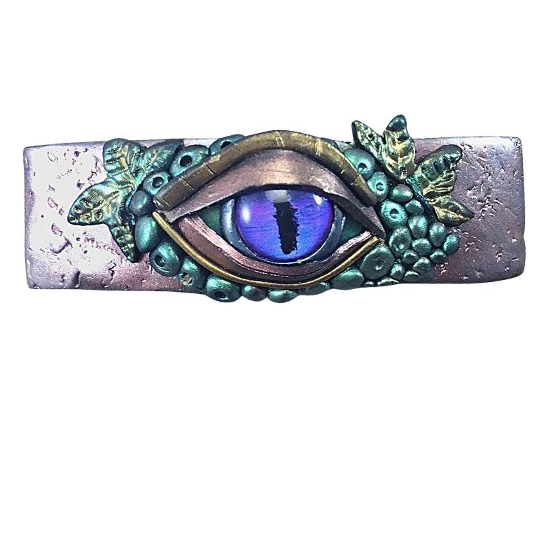 purple evil eye hair barrette sculpted with polymer clay with forest leaves