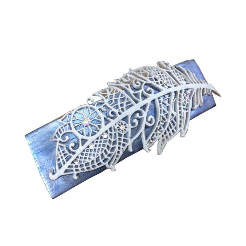Silver blue polymer clay handmade hair barrette with silver clay mandala feather and crystals with rainbow luster dotted around the feather design.