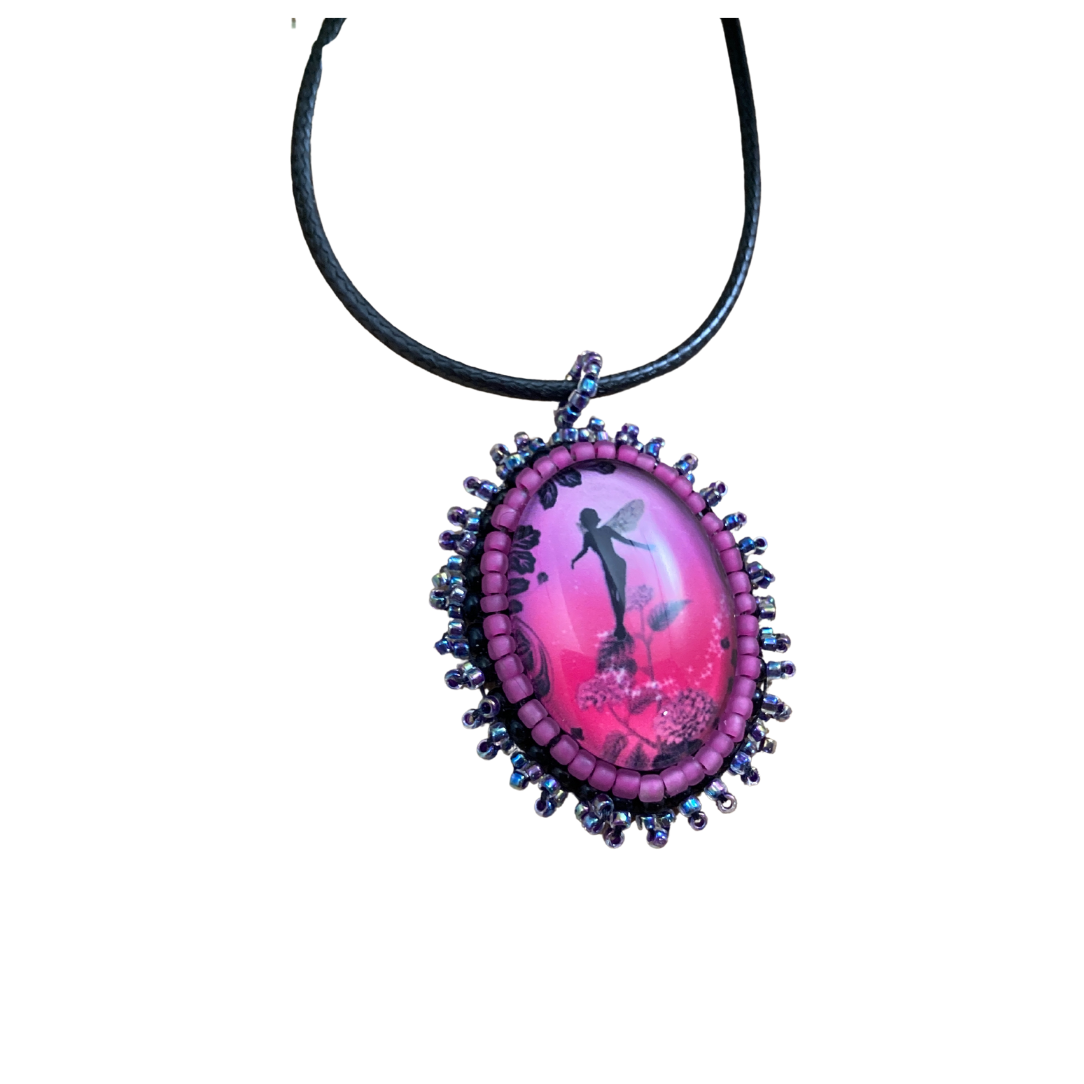 hot pnk flower fairies pendant with black and pink seed beads.