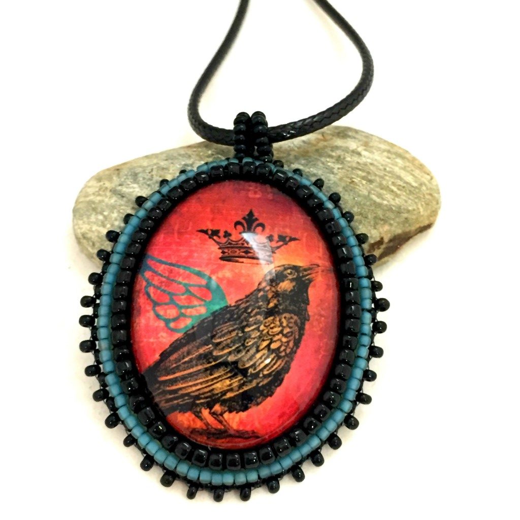 Raven with teal wing pendant