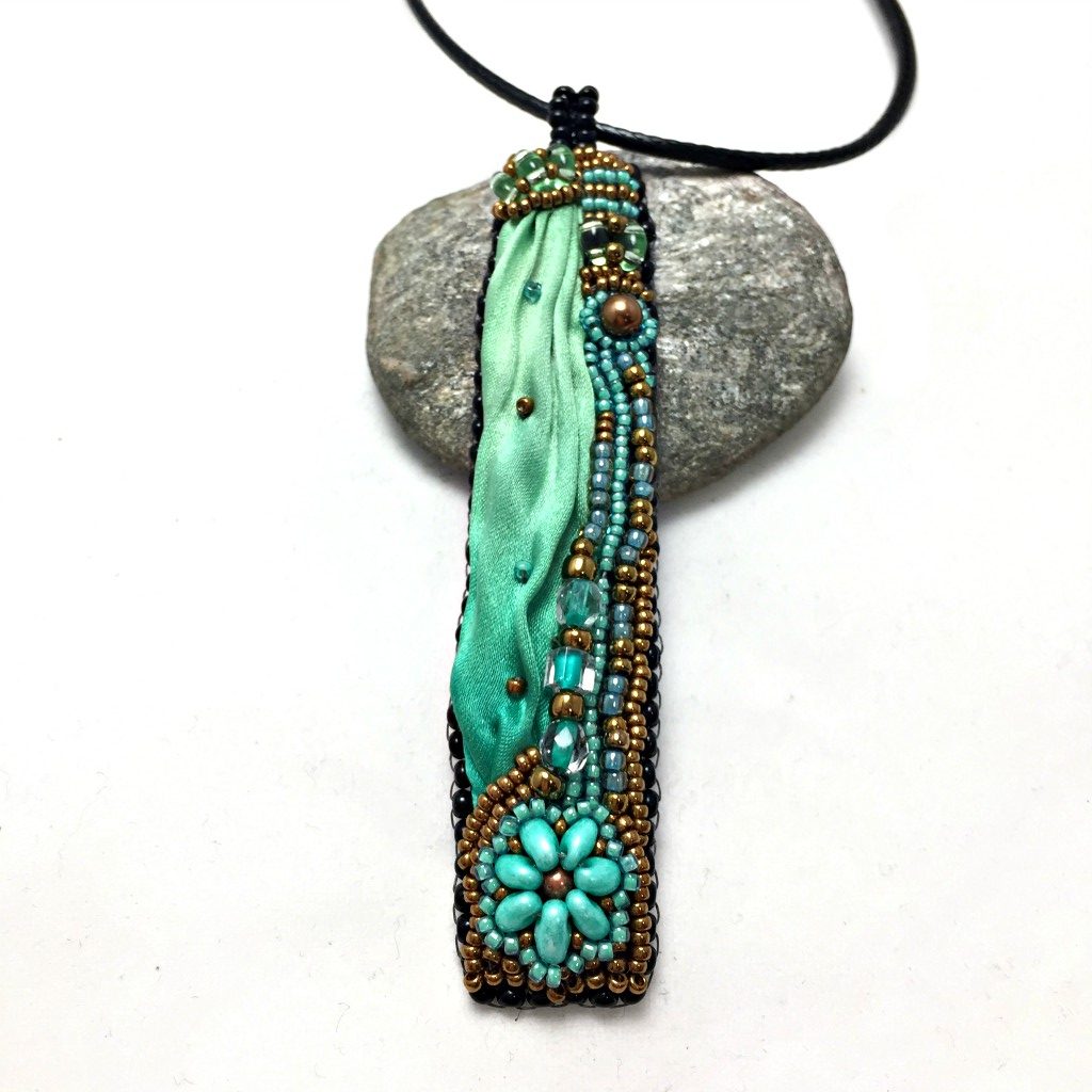 Long green silk pendant