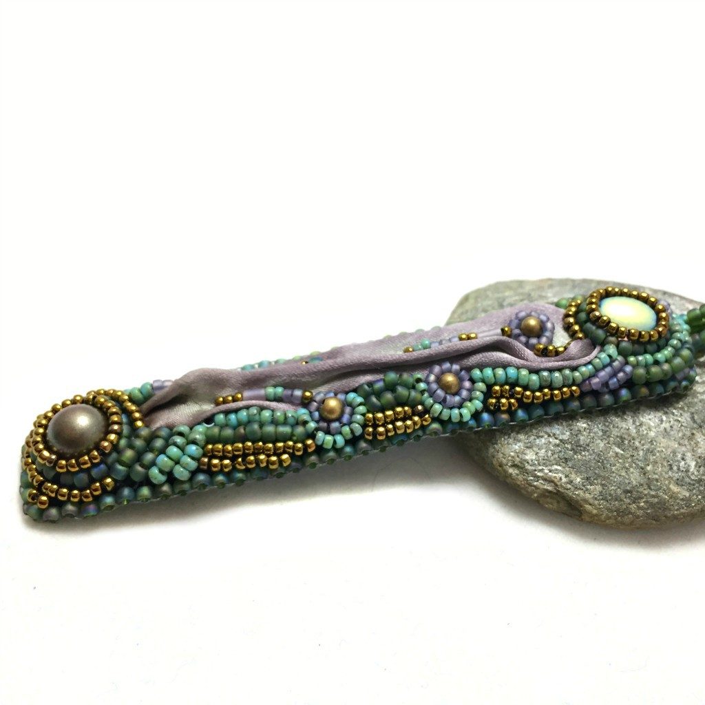 mauve and green long pendant side shot