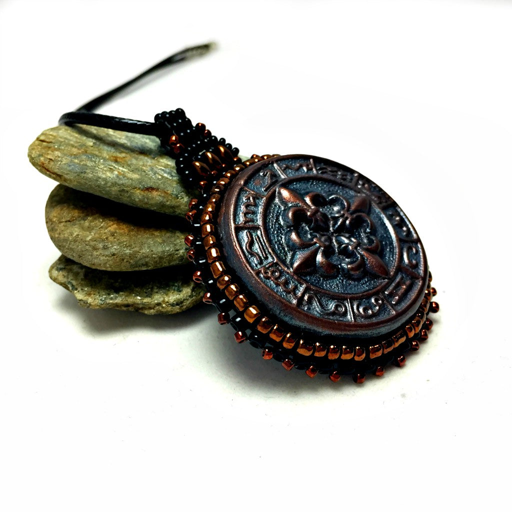 mayan bronze pendant side shot