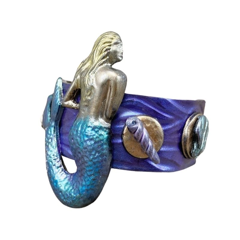 mermaid hair clip with blue and purple tail and sea shells along the sides