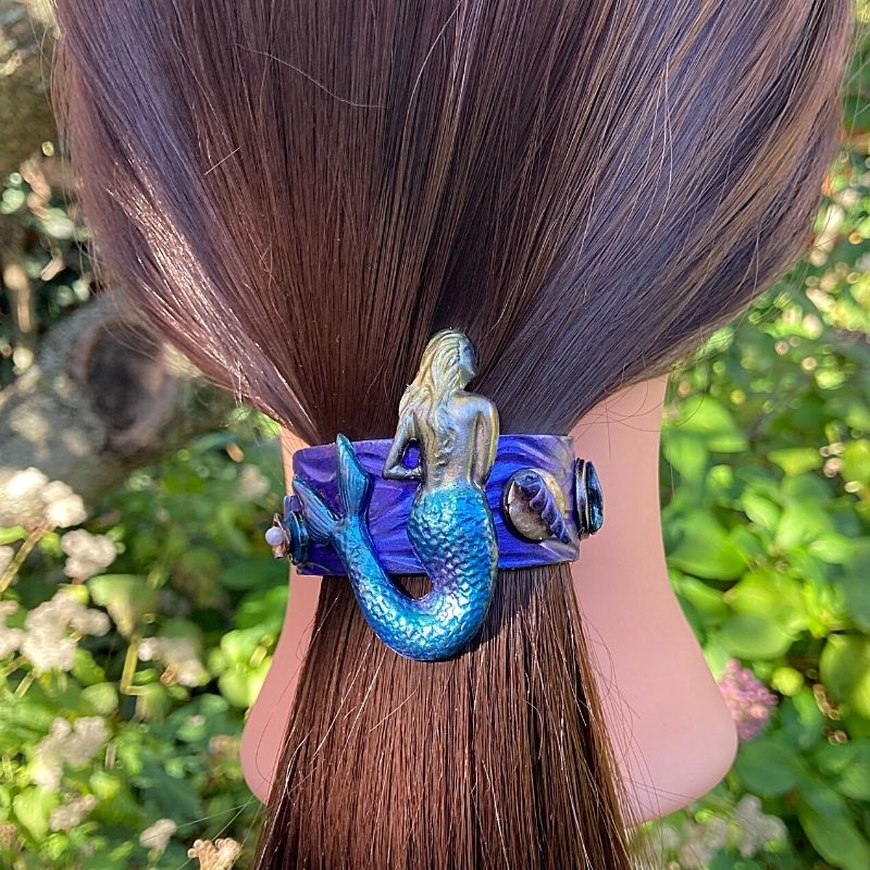 handmade mermaid ponytail barrette with mermaid and sea shells along the side of the clip