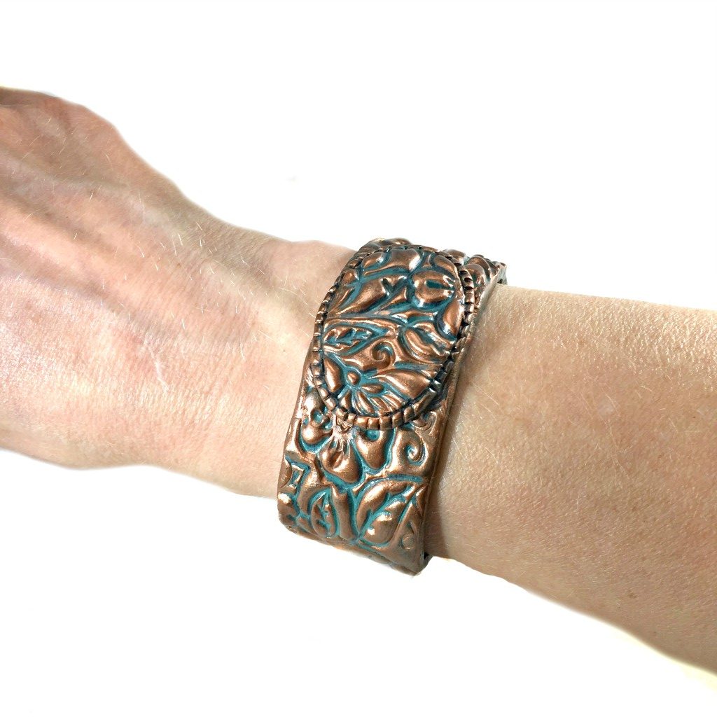 patina cuff on arm