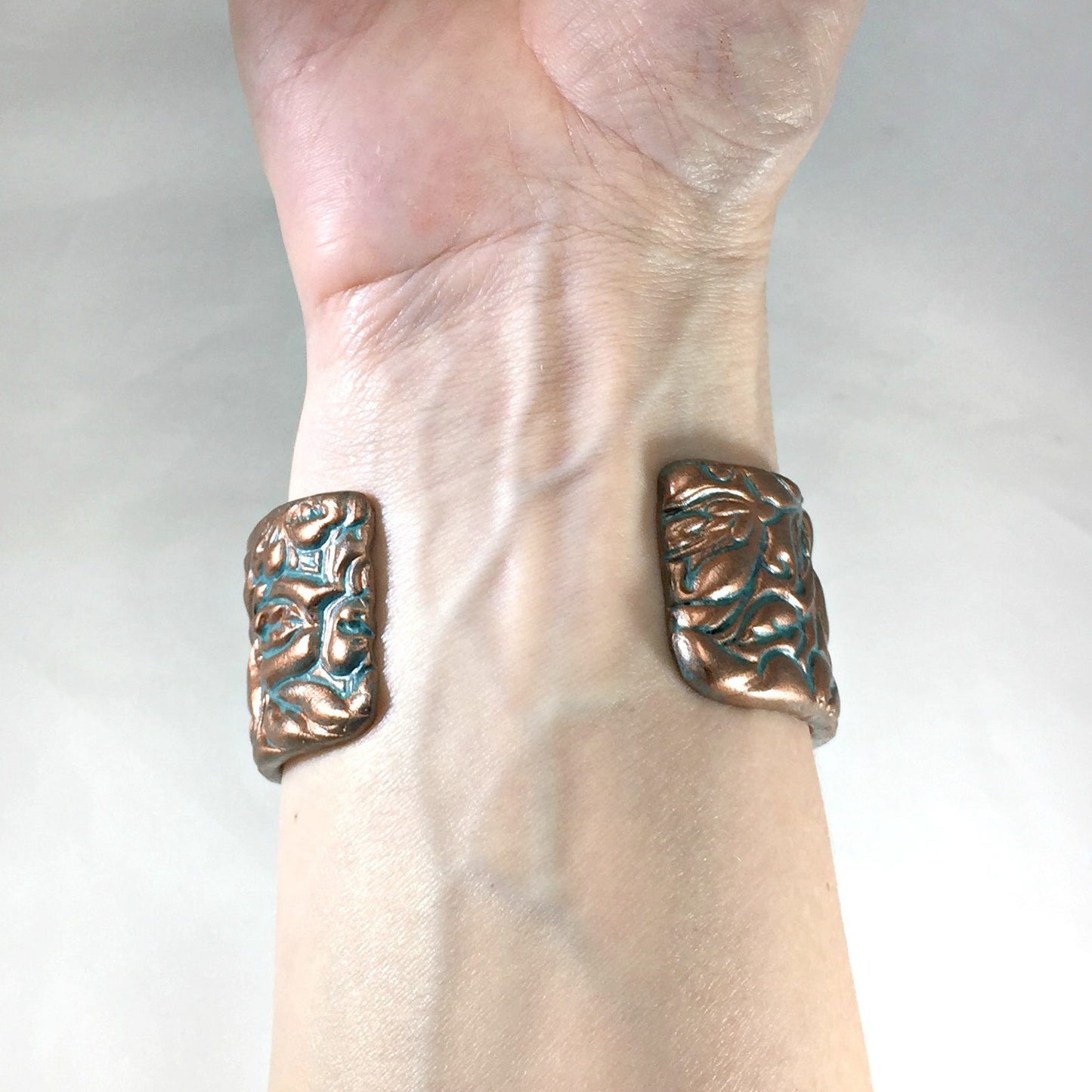 patina cuff on underneath arm