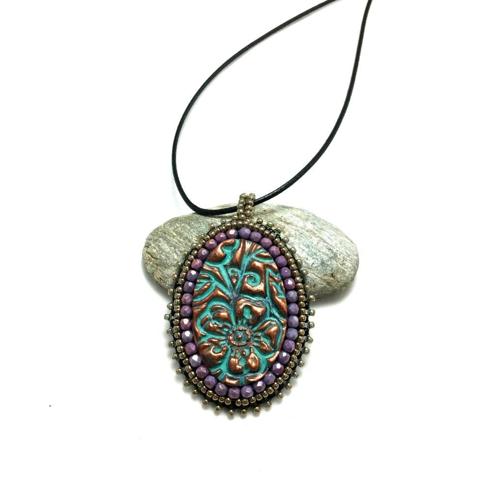 distance photo of purple crystal patina necklace