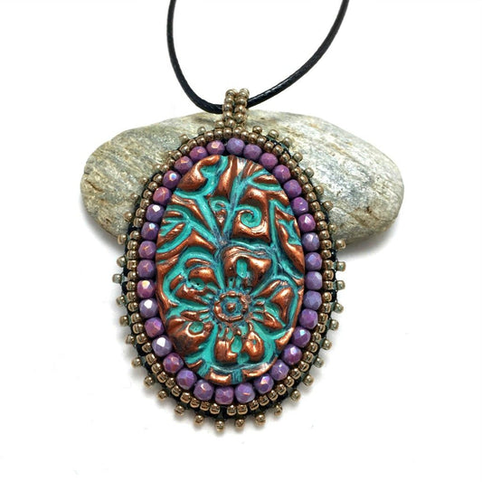 Purple crystal copper patina pendant
