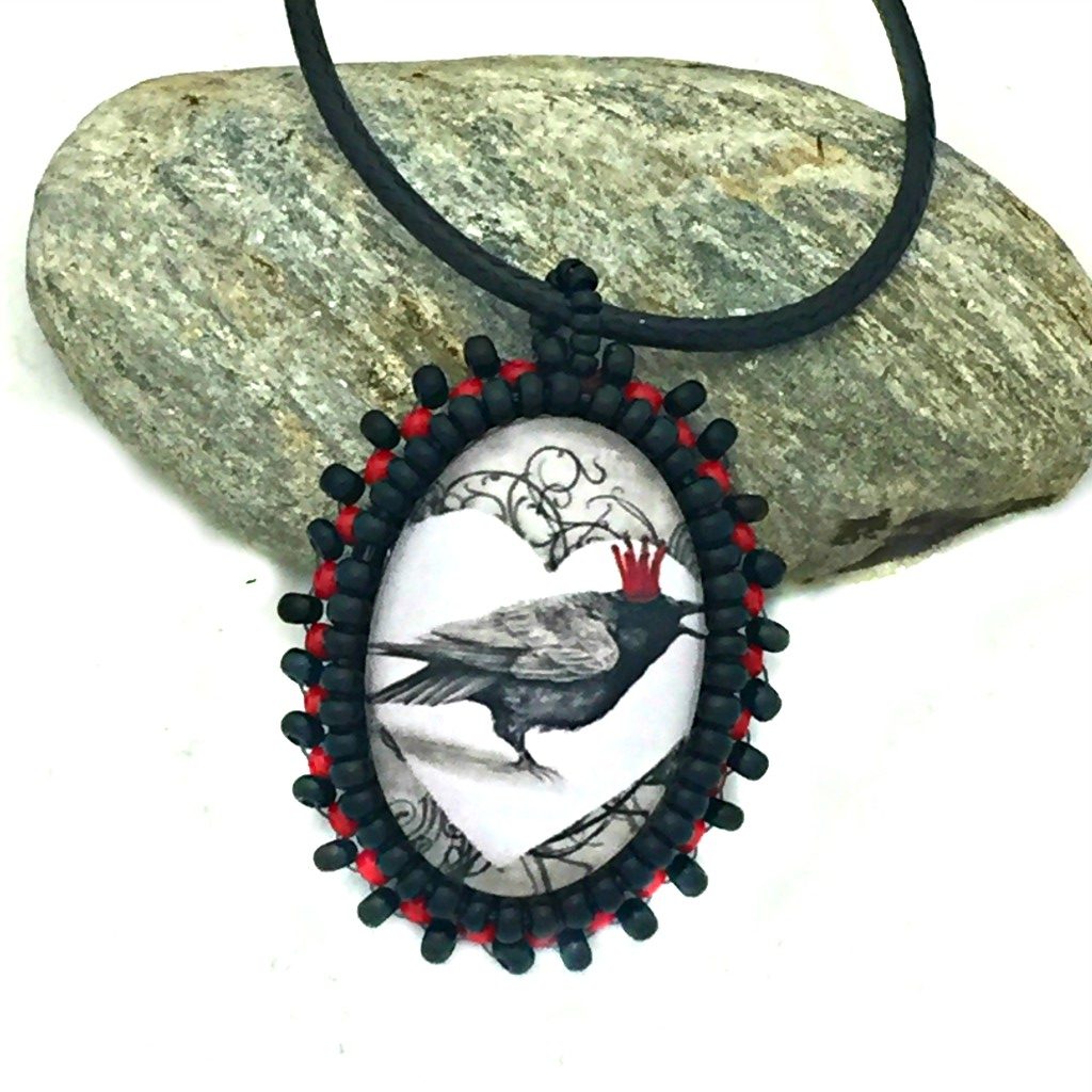 Red crown raven beaded pendant
