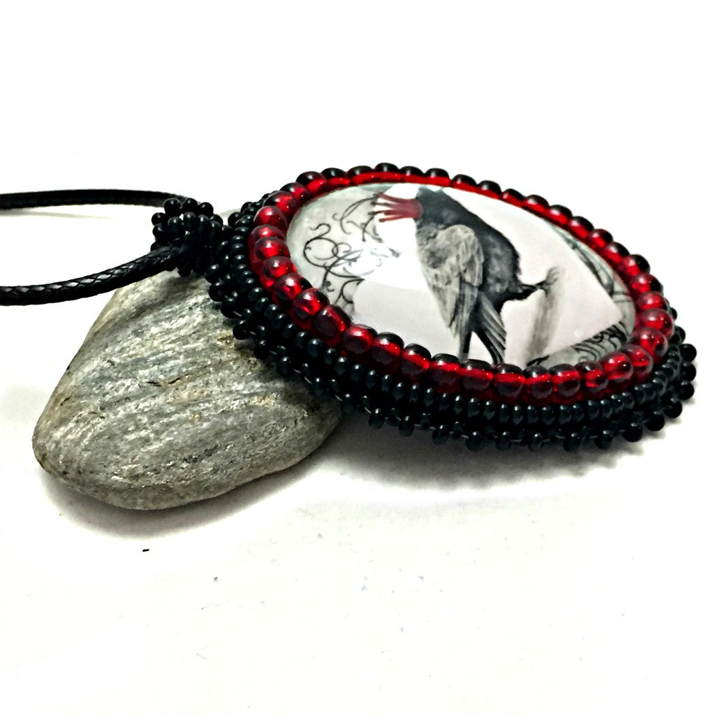 red crown raven pendant left side