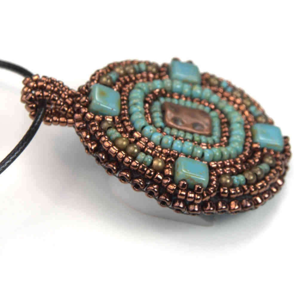 round aztek beaded art pendant statement bronze