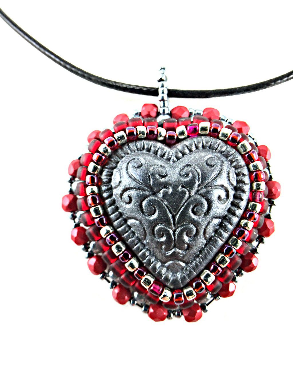 silver heart pendant with red beads