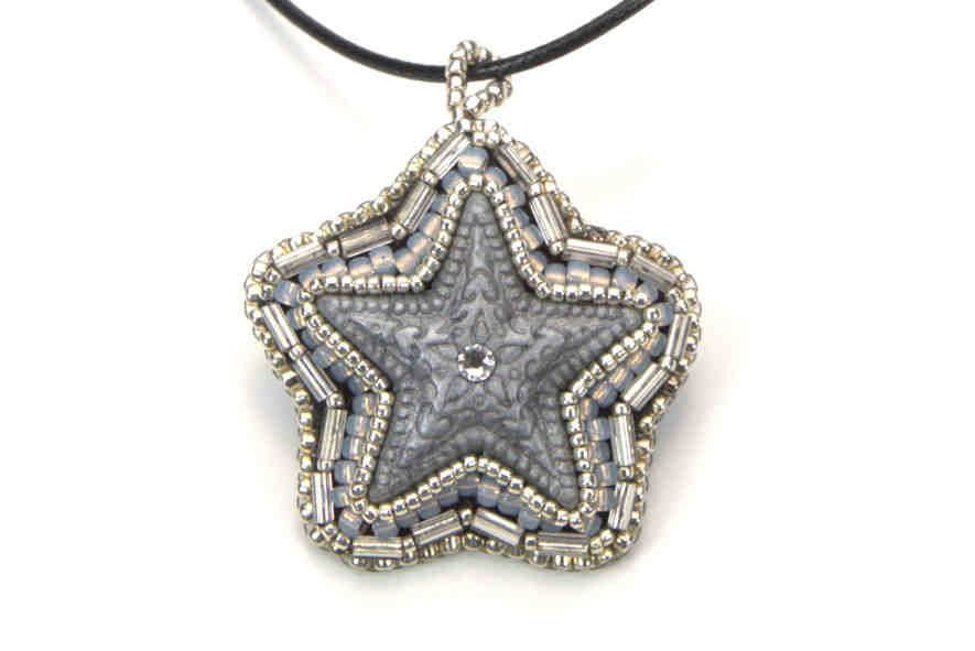 silver star pendant crystal center grey tubular beaded art