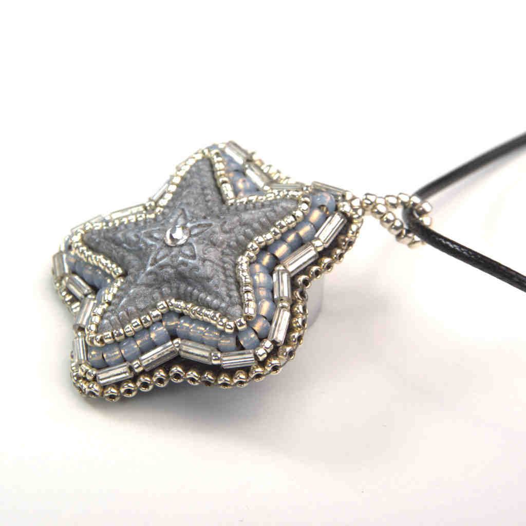 silver star pendant crystal center grey tubular beaded art