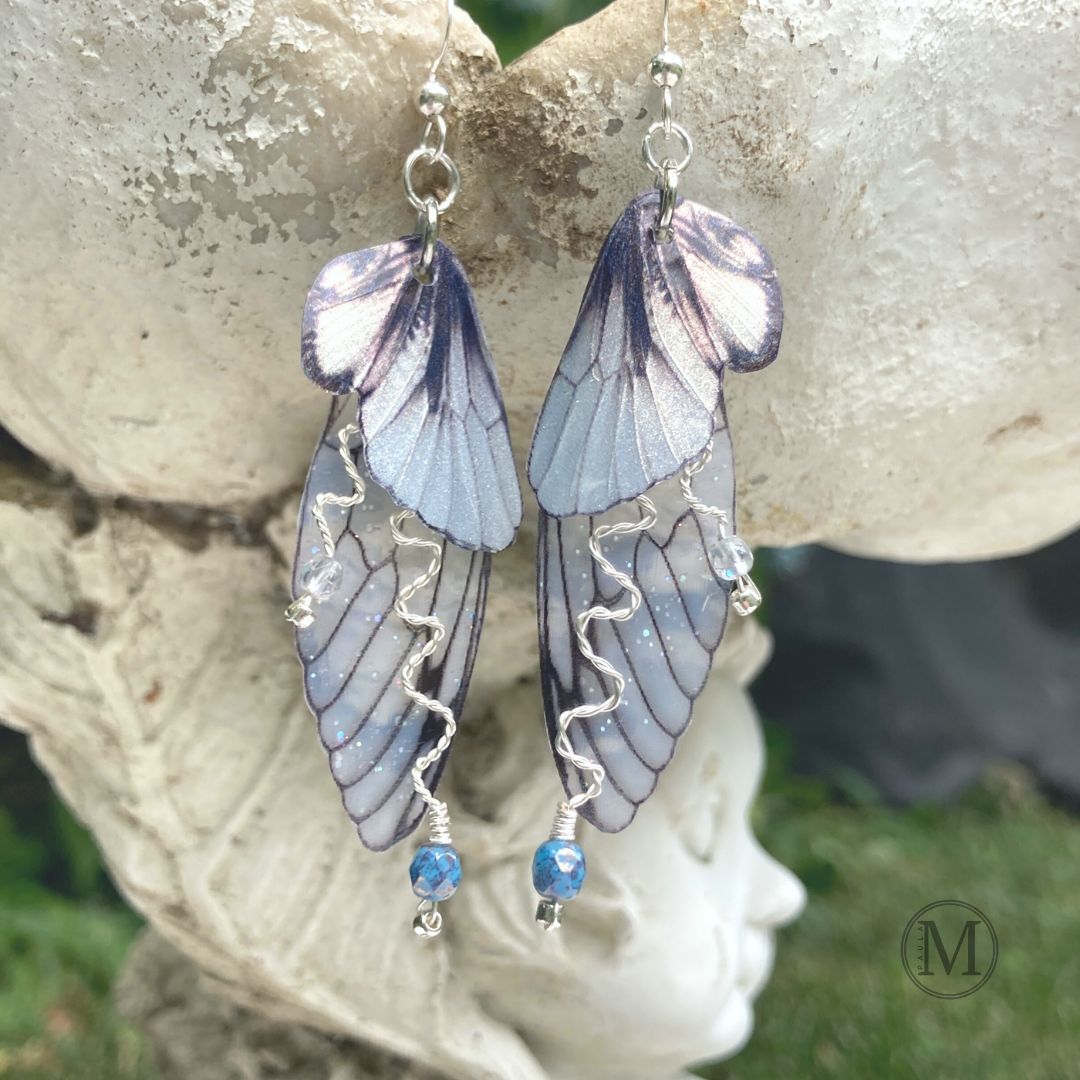 Silver translucent butterfly wing earrings with silver wire blue crystals and silver ear wires