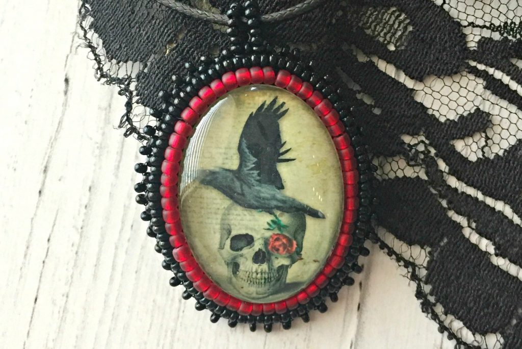 raven and skull pendant