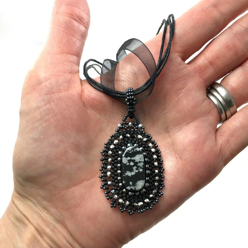 victorian lace gothic pendant in hand