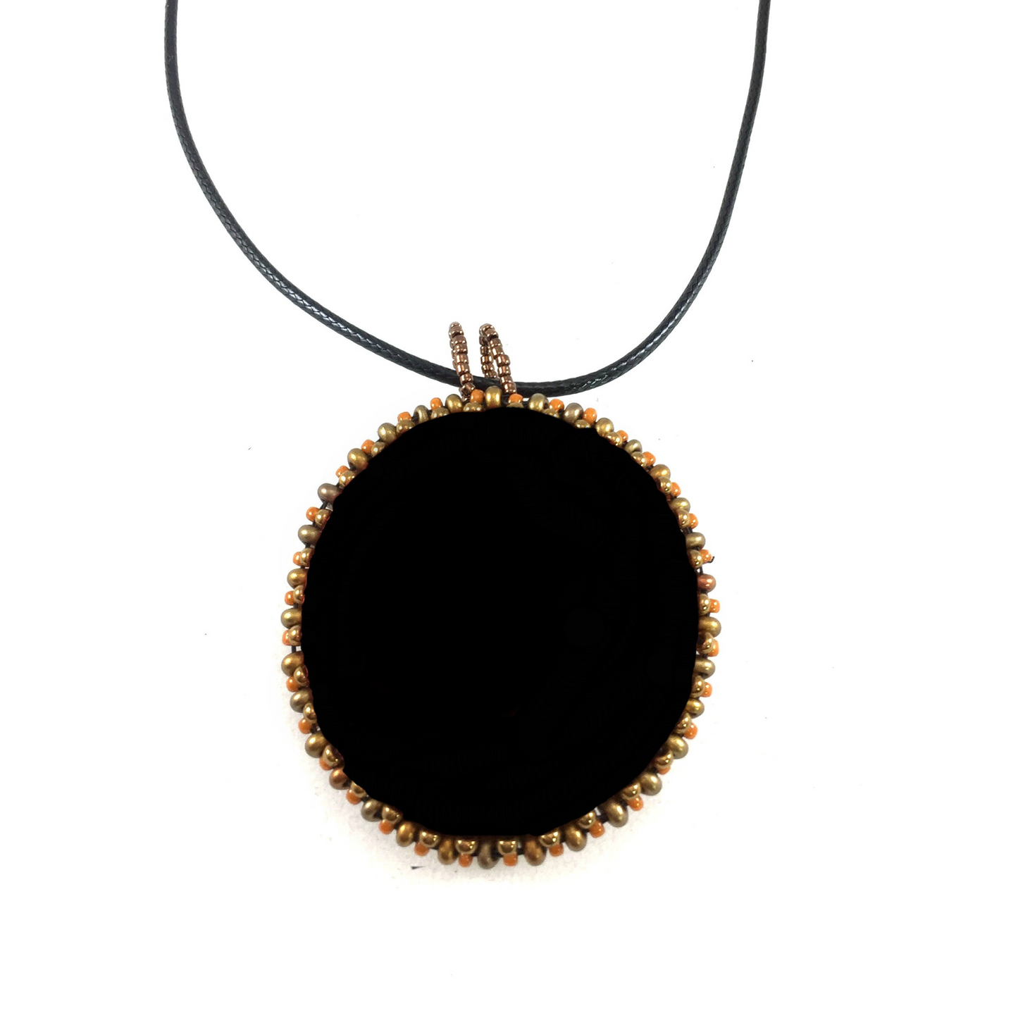 Back of Sun Necklace. Black faux suede and beaded edge of Pendant.