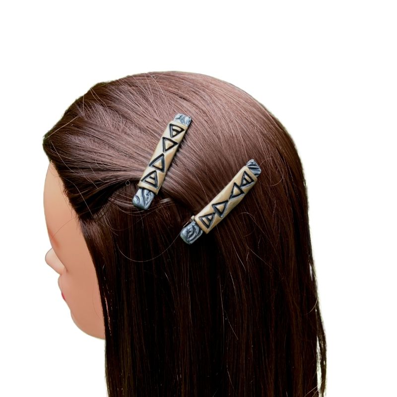 Alligator hair slides on model with the four elements
